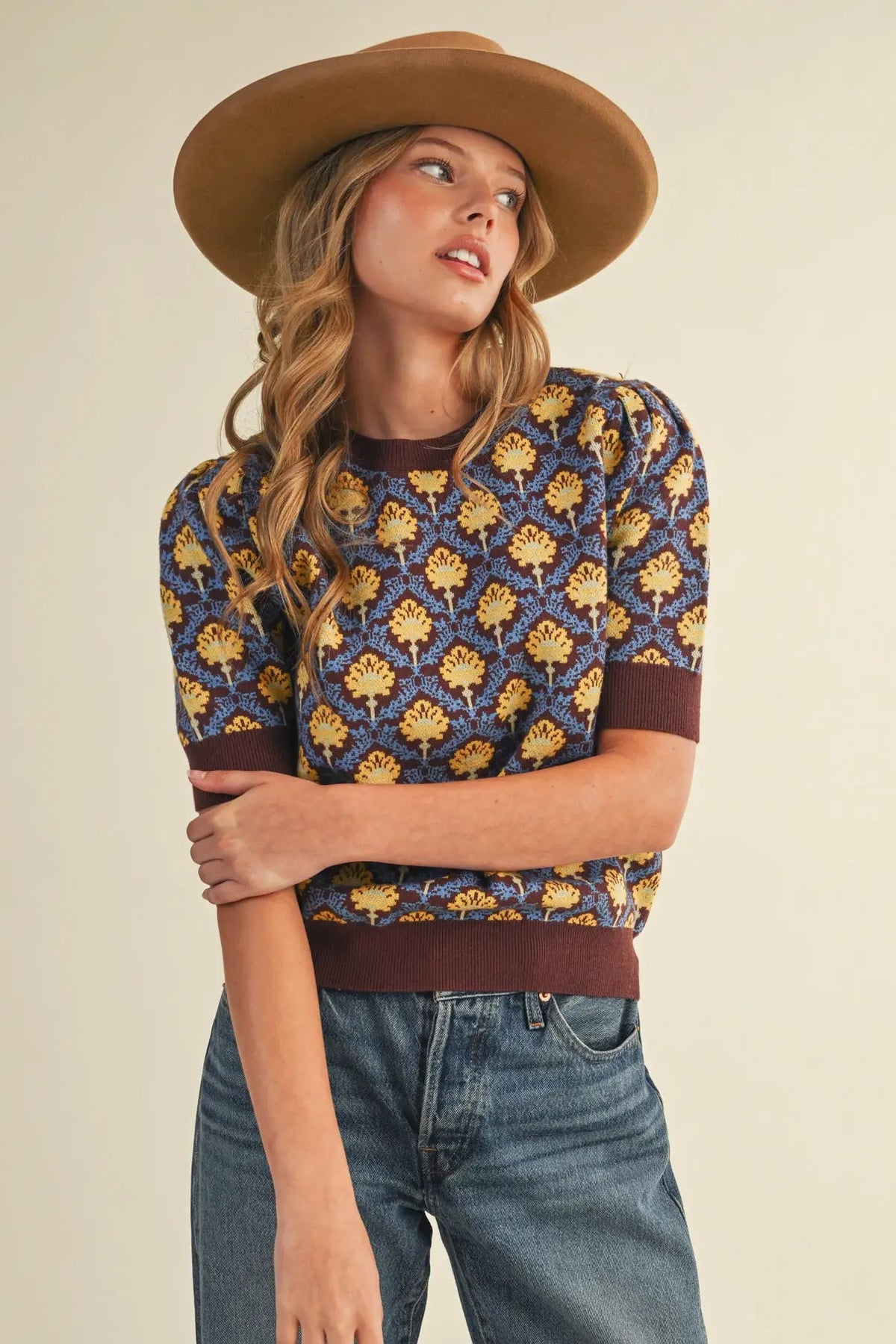 woman in floral short sleeve sweater and jeans 