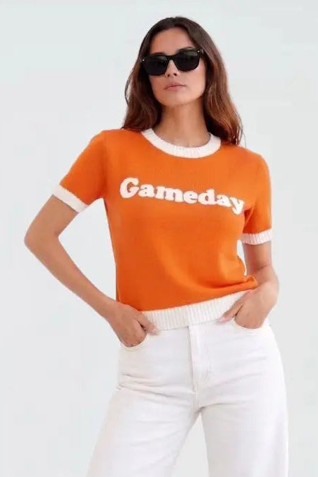 woman wearing orange game day sweater