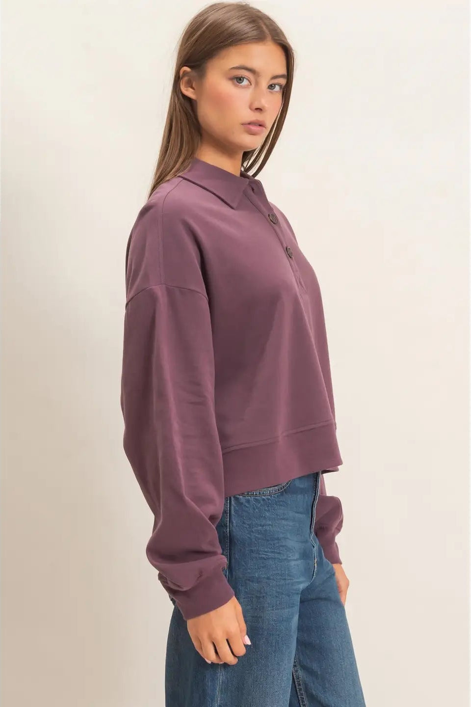 woman in button sweatshirt and jeans