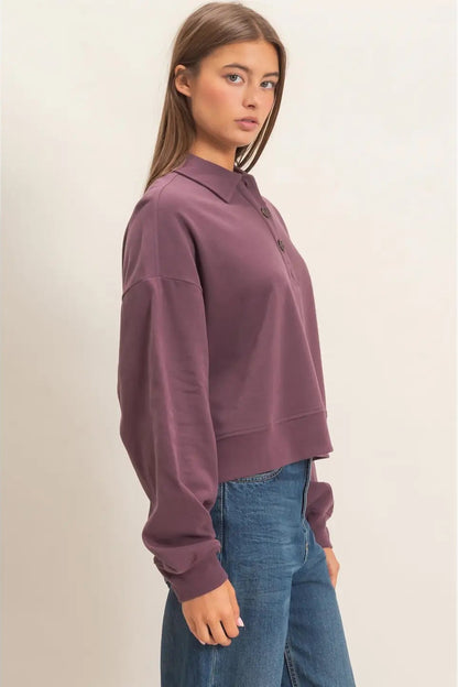 woman in button sweatshirt and jeans