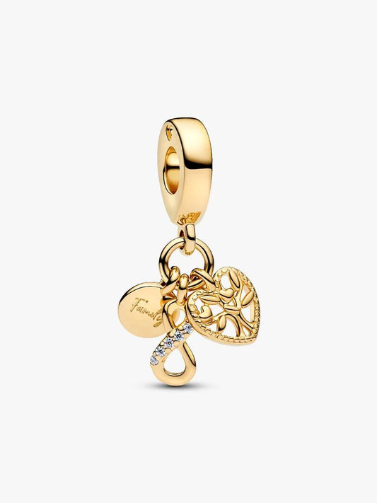 Gold charm with heart and tree design on a white background