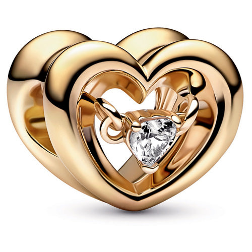 Gold heart-shaped jewelry with a central gemstone on a white background
