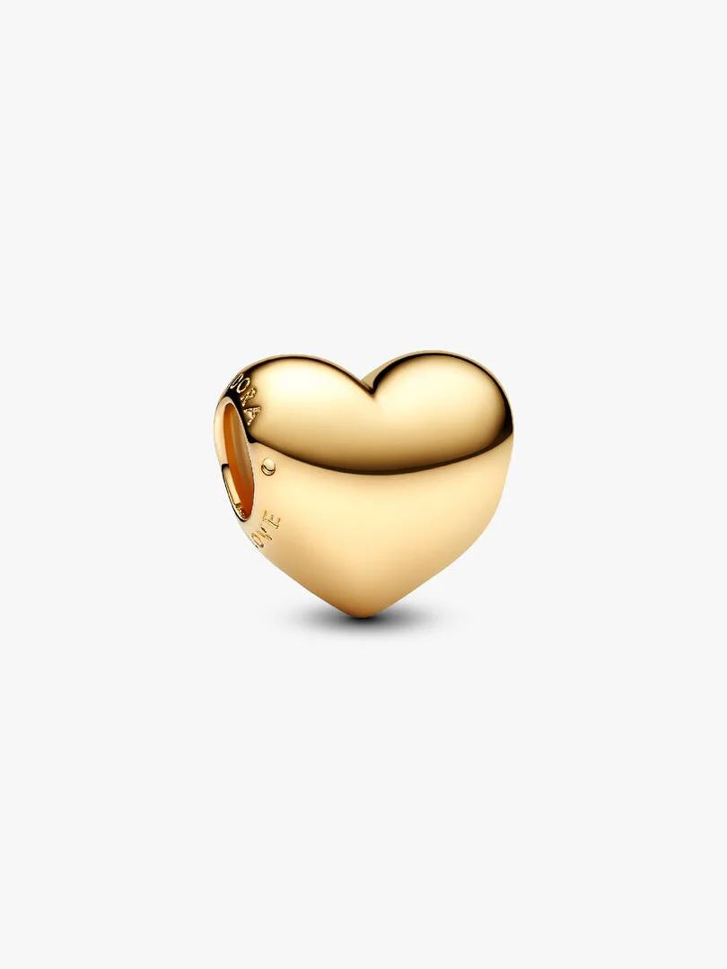 Gold heart-shaped charm on a white background