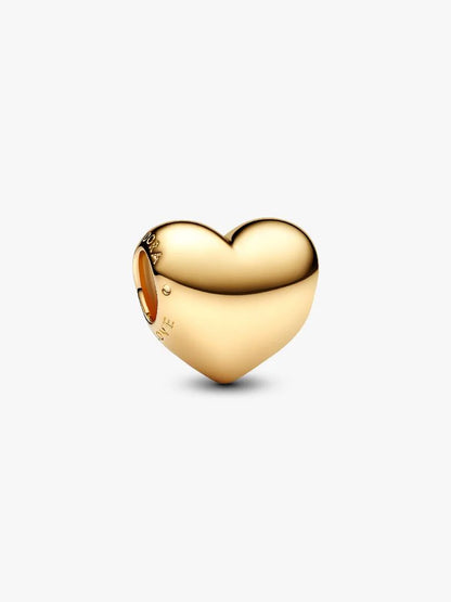 Gold heart-shaped charm on a white background