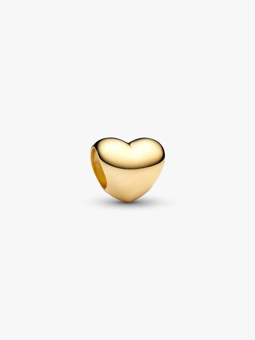 Gold heart-shaped charm on a white background