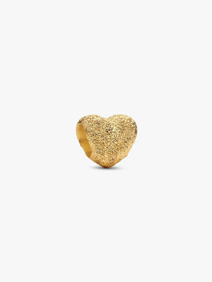 Gold heart-shaped ring on a white background