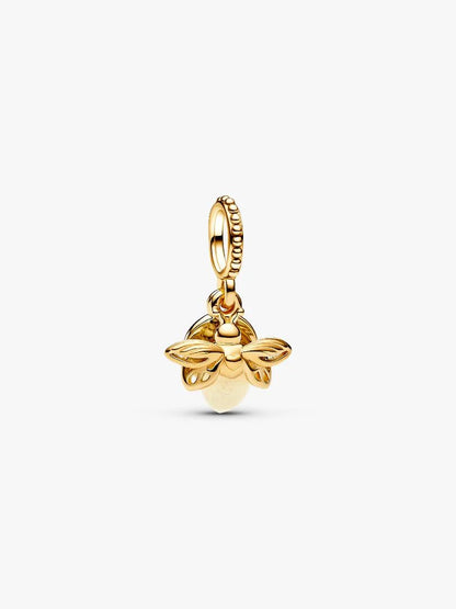 Gold bee-shaped pendant on a white background