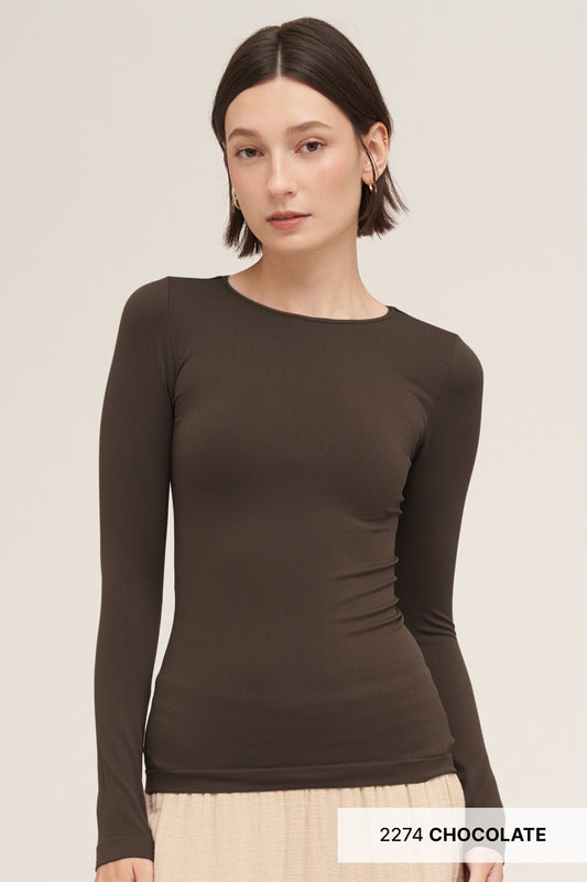 A woman modeling a fitted long-sleeve crew-neck top in dark chocolate brown, paired with a light beige skirt. The image has a text overlay at the bottom right reading '2274 CHOCOLATE'.