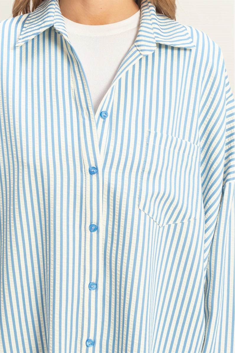 woman wearing blue stripe button up shirt 