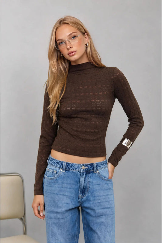 woman in mock neck top and jeans