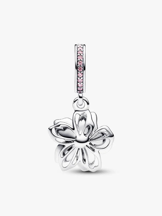 Silver butterfly pendant with pink gemstones on a white background