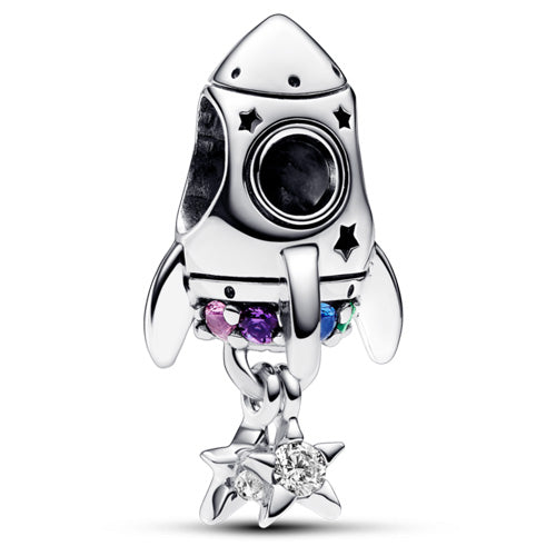 A sterling silver space-themed charm bead featuring a detailed rocket ship with a black circular window, small black star accents, and dangling star charms set with clear and colored gemstones, shown on a white background.