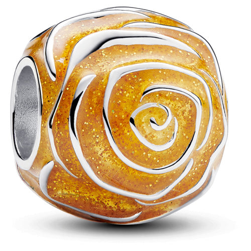 A round sterling silver charm bead featuring a detailed rose design filled with textured gold glitter and enamel.