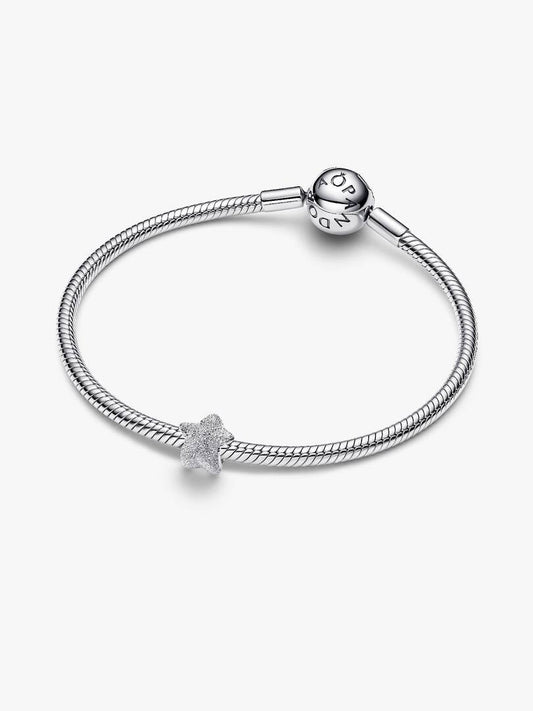 Silver bracelet with a star-shaped charm on a white background