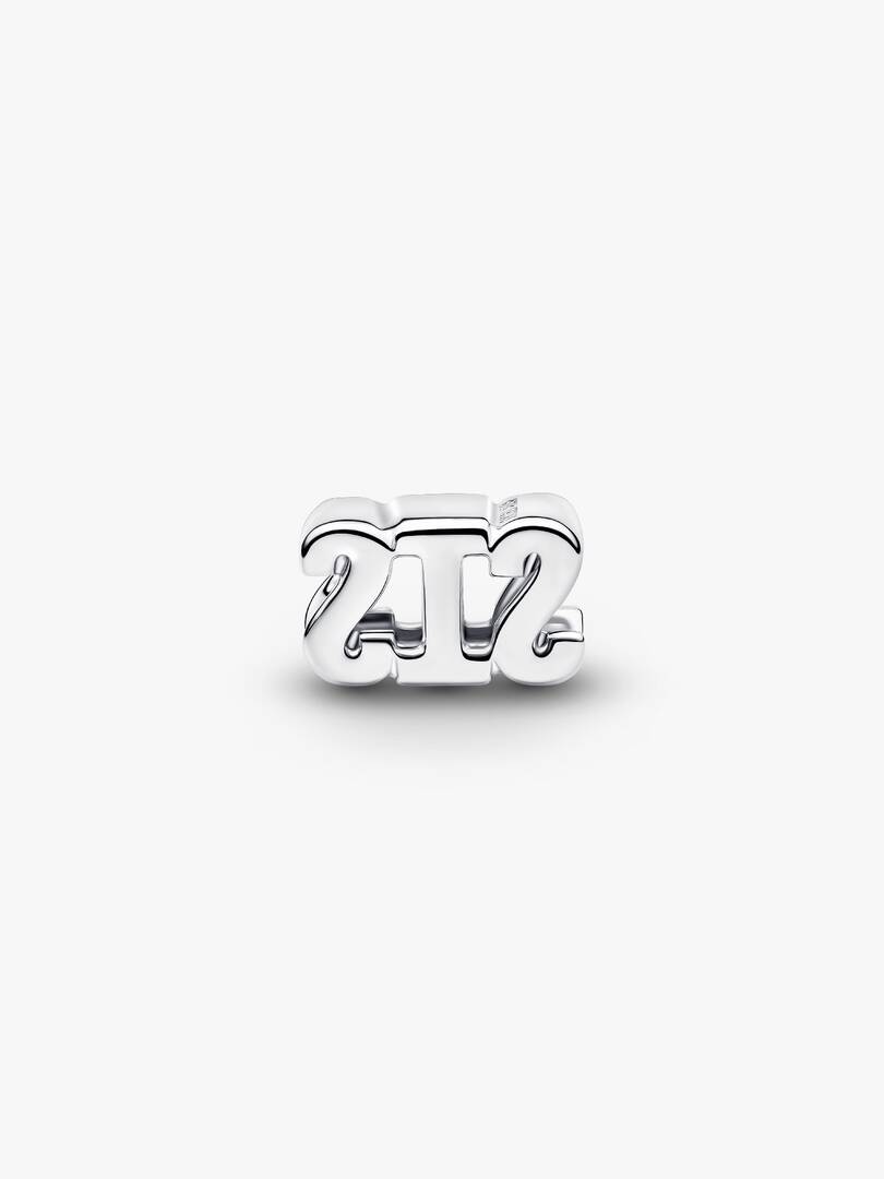 Silver '24/7' charm on a white background