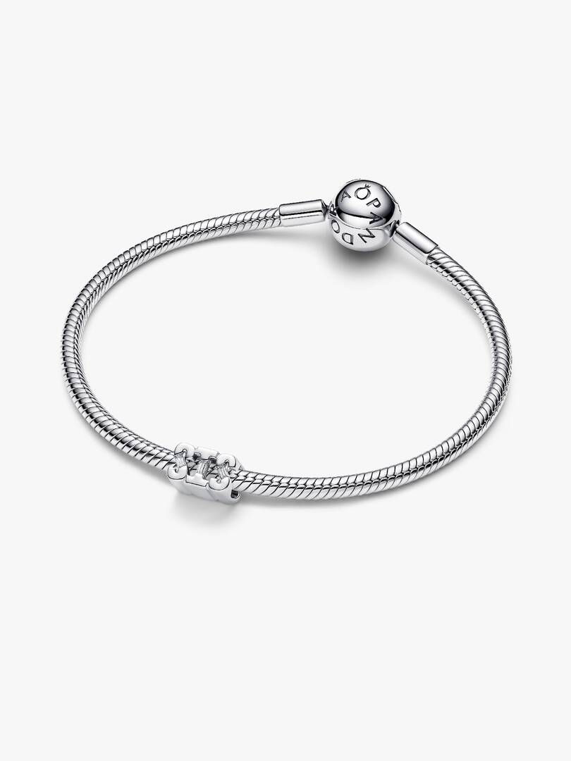 Silver bracelet with a clasp on a white background