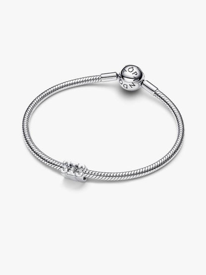 Silver bracelet with a clasp on a white background