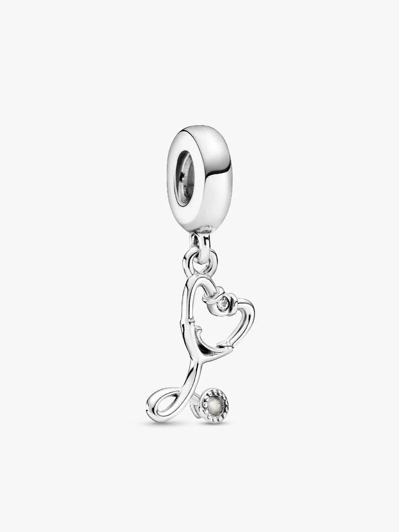 Silver charm with a heart and pearl on a white background