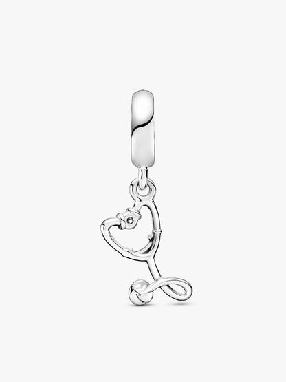 Silver charm with a heart and arrow design on a white background