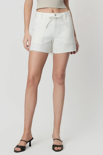 White shorts worn by a person on a white background