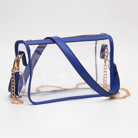 Clear handbag with blue accents and gold chains on a white background