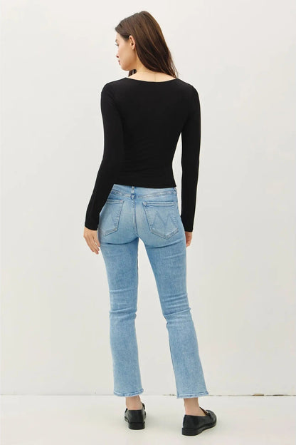 woman wearing square neck long sleeve top with jeans