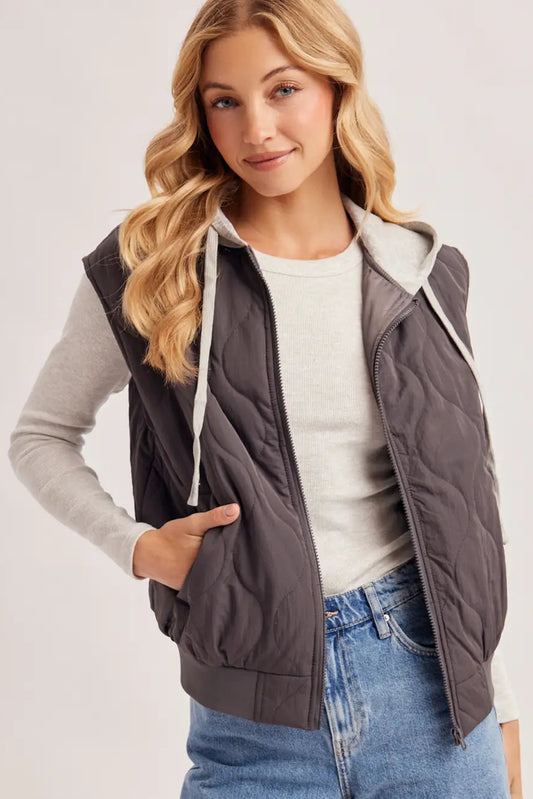 woman in gray quilted vest 