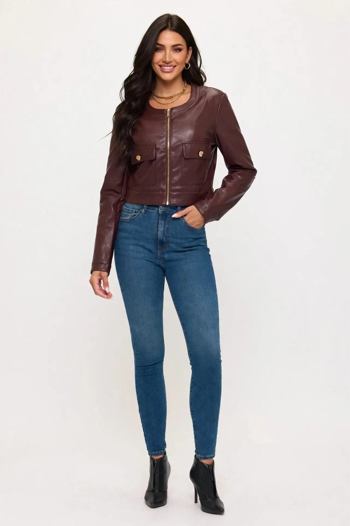 woman in cropped leather jacket and jeans