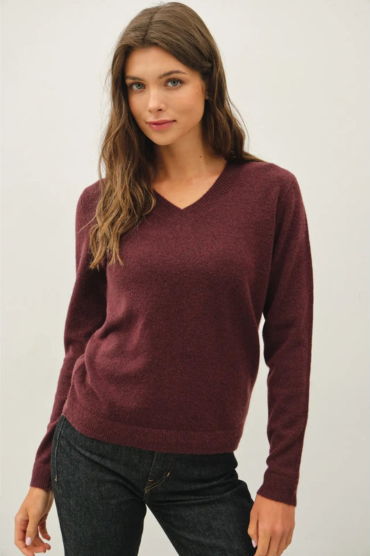 woman in sweter and jeans