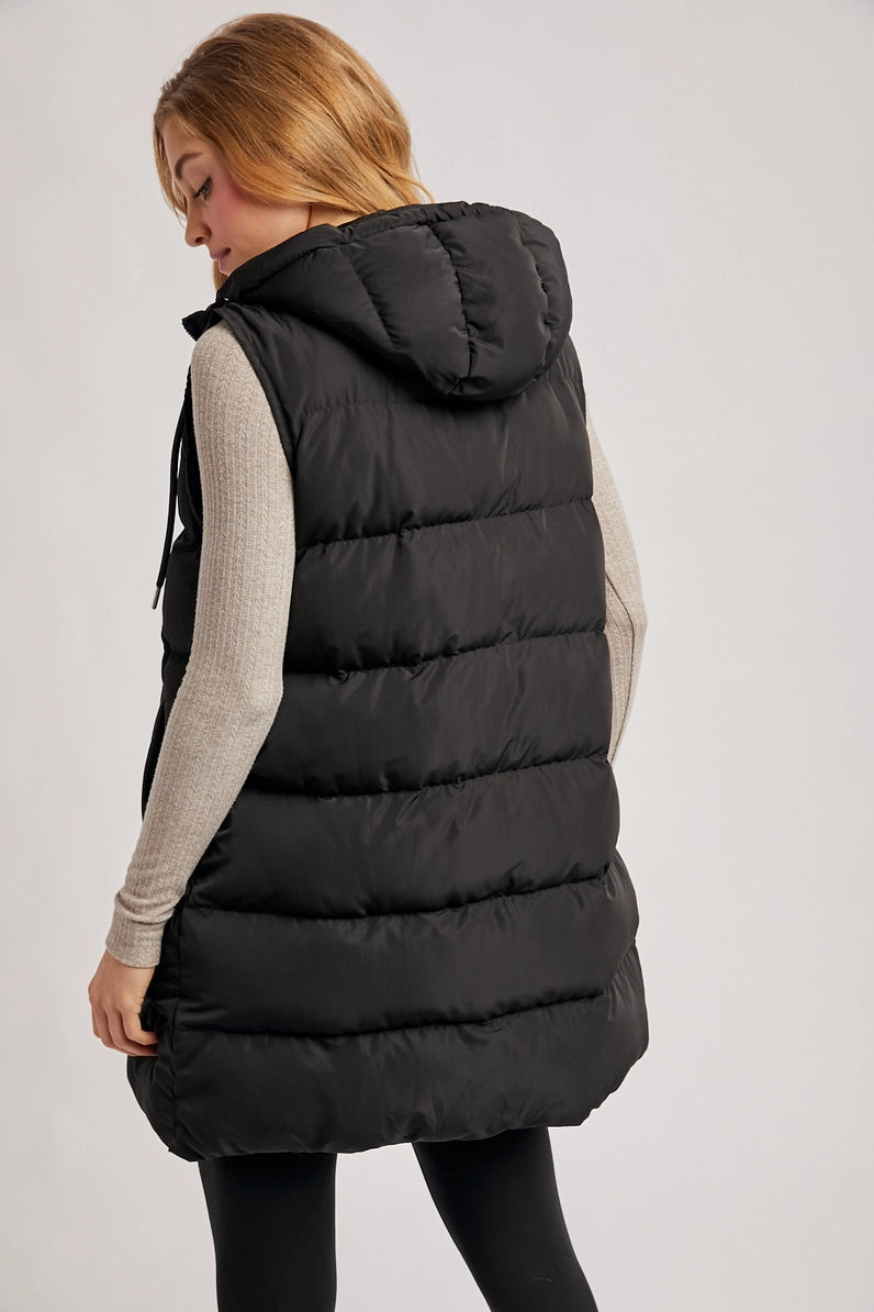 back view of woman in puffer vest