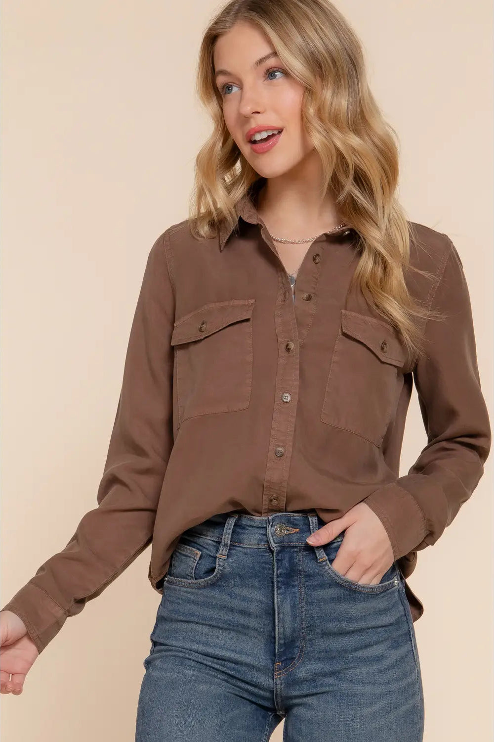 woman in button up shirt and jeans
