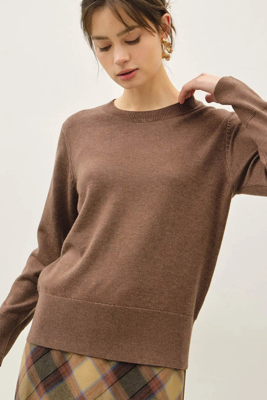 woman in brown sweater