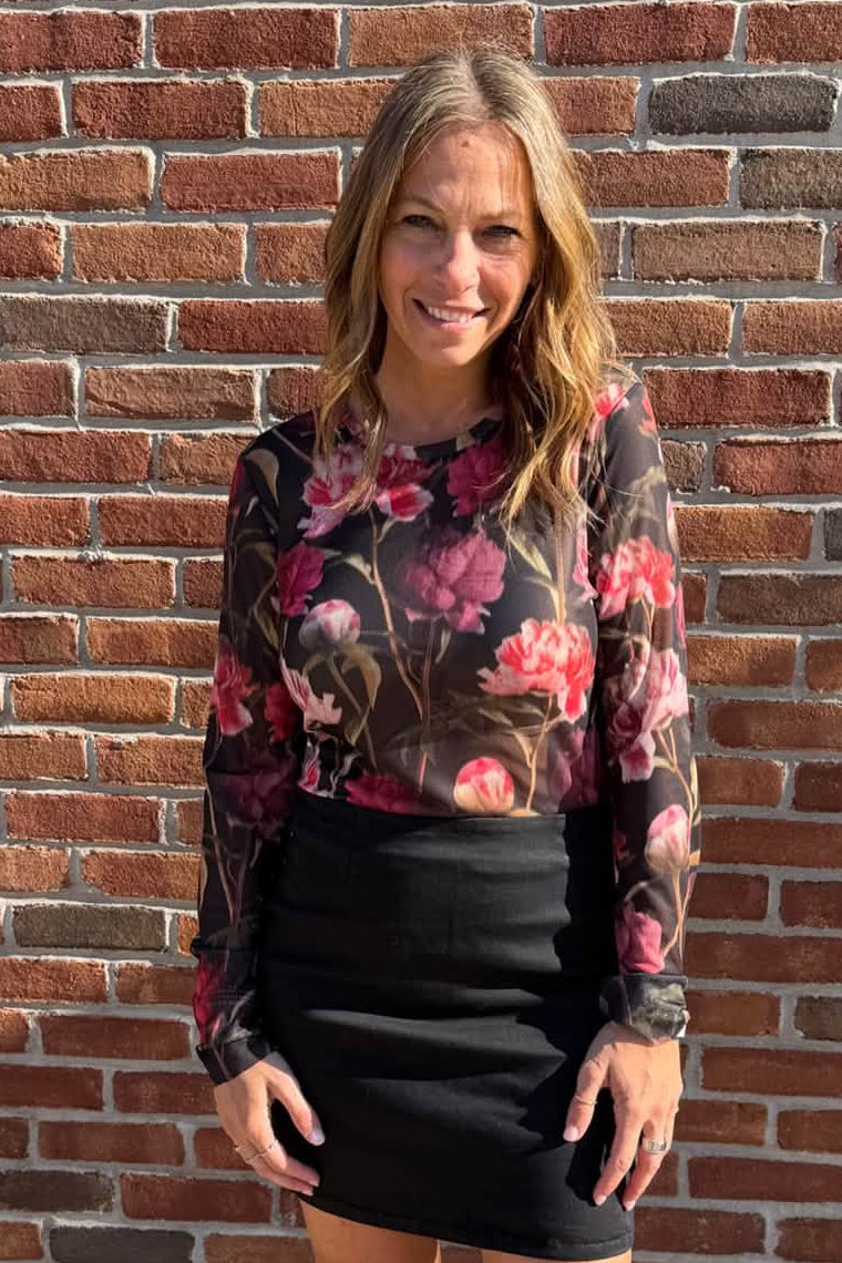 woman in floral mesh top and skirt 