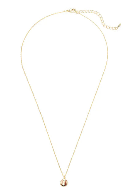 Gold necklace with a small pendant on a white background