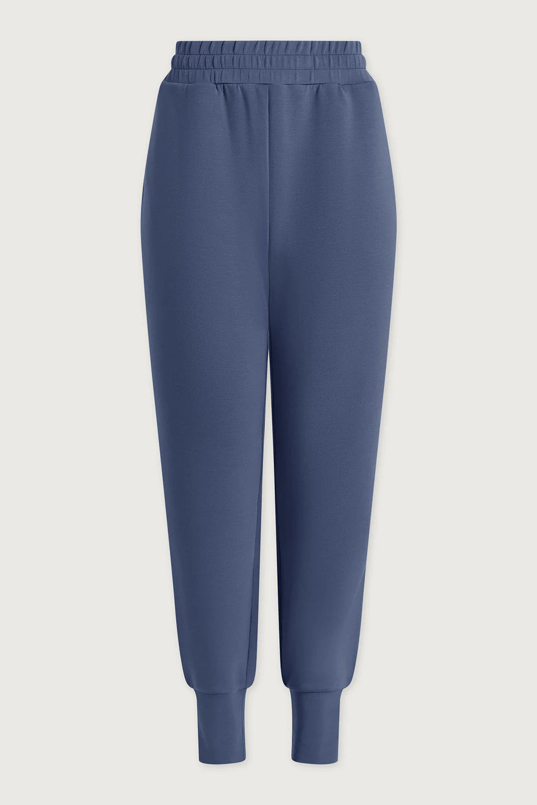 Blue sweatpants on a light gray background