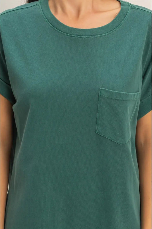 Green t-shirt with a pocket on a plain background