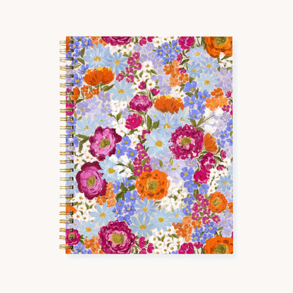 Floral patterned notebook with colorful flowers on a white background