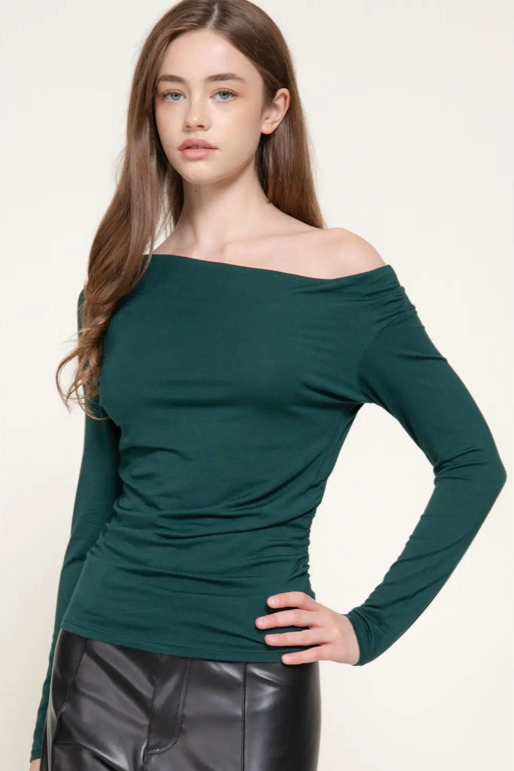 woman in green top and black pants