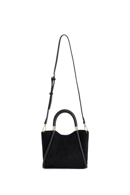 Black beaded handbag with tassel on a white background