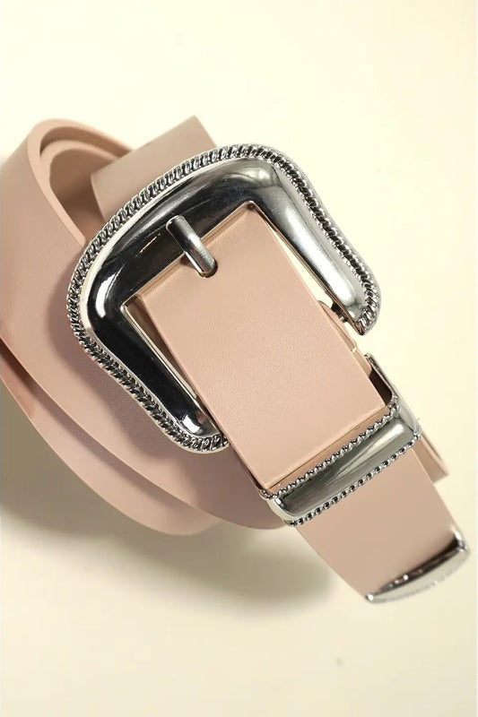 Beige sandal with a silver buckle on a beige background