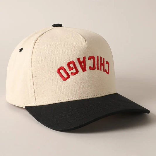 Beige and black cap with 'Chicago' in red on a light gray background