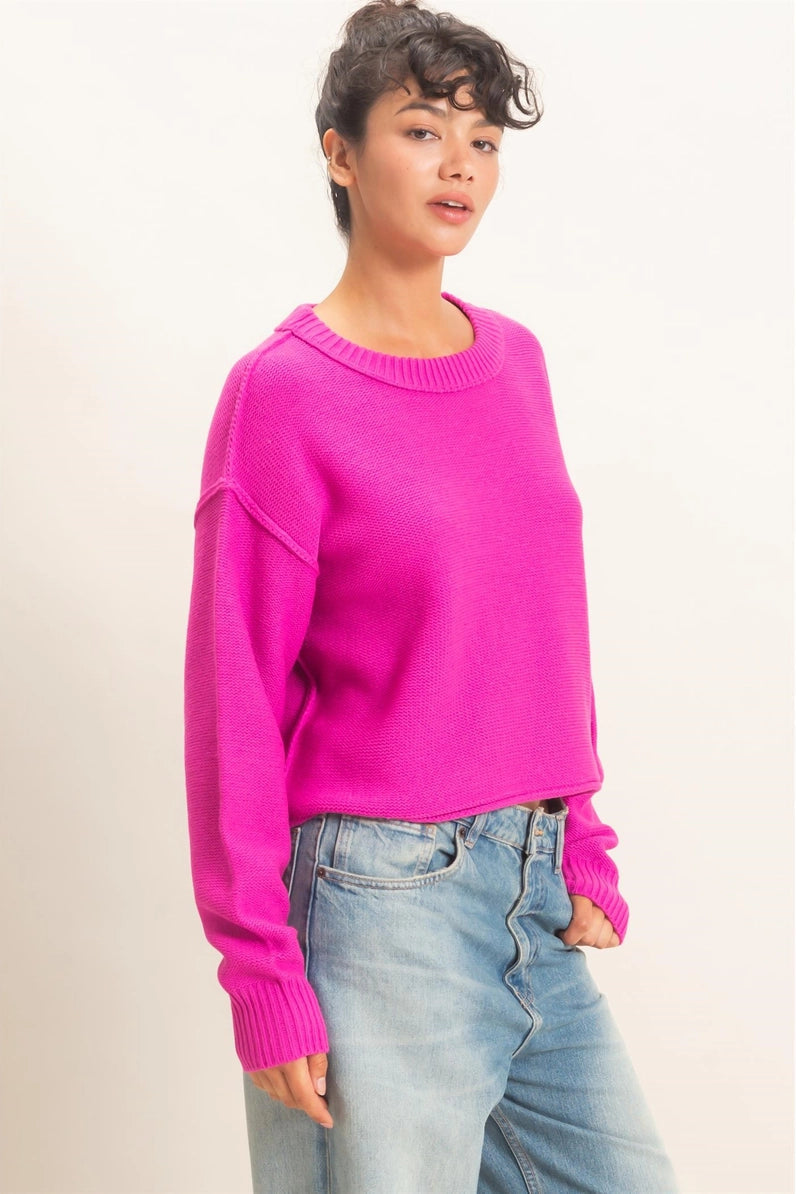 woman wearing pink sweater