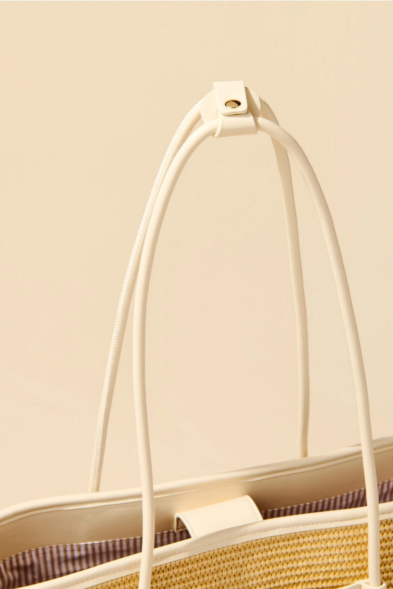close up of handles of tote