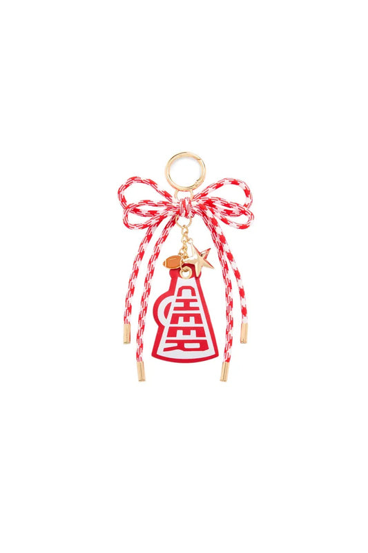A red and white braided bow charm with a gold-tone ring, dangling red and white braided cords, a small gold star, and a red and white braided bottle charm featuring a gold Chinese double happiness symbol.