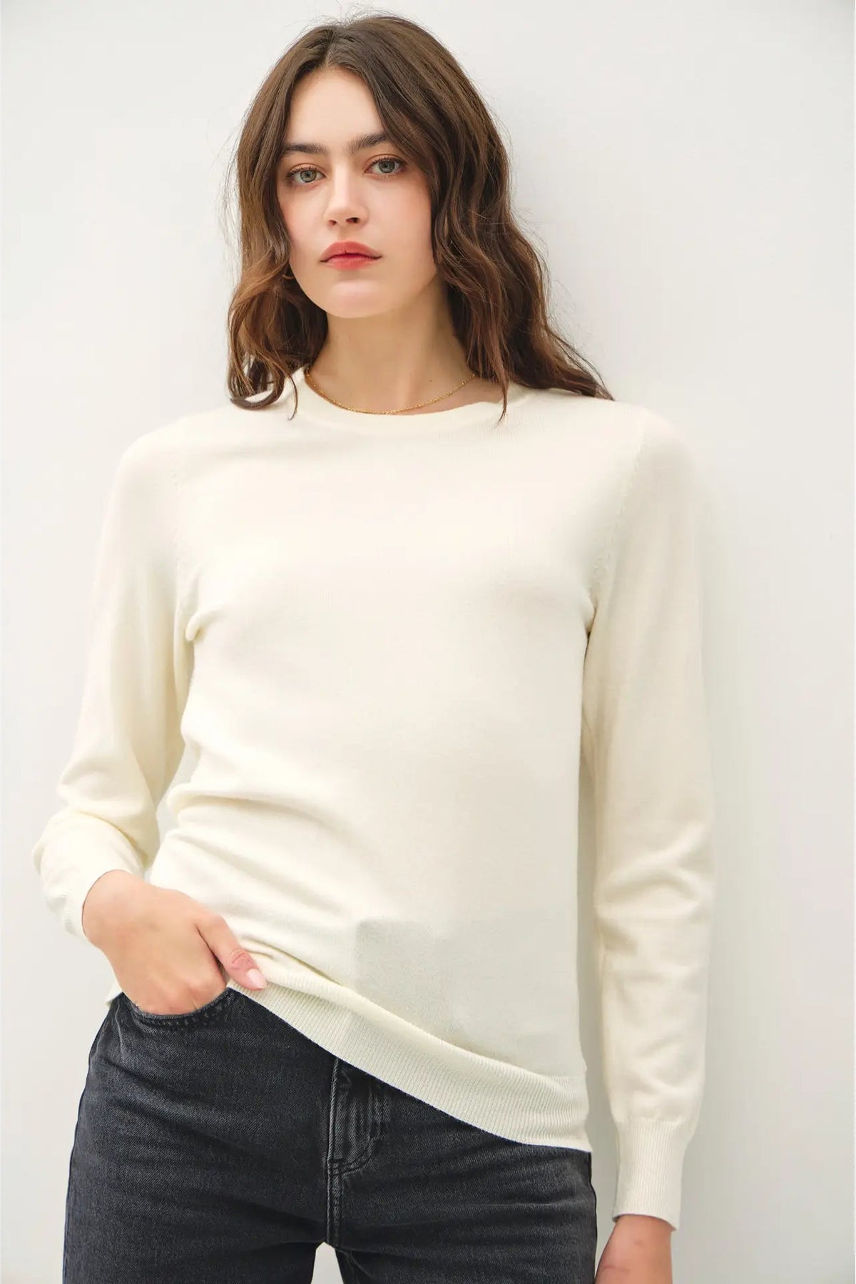 woman wearing sweater with jeans 