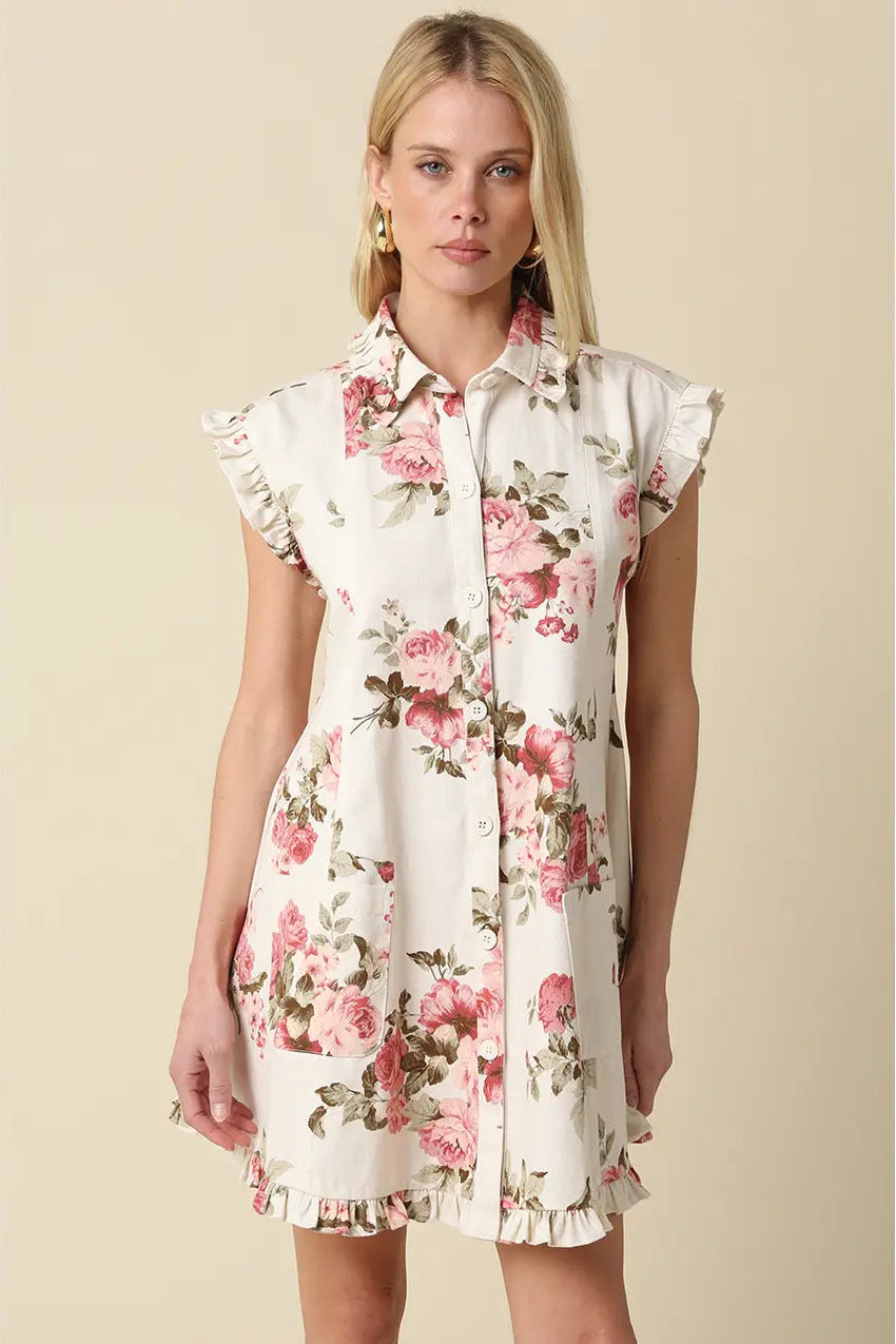 Woman wearing a floral dress against a beige background