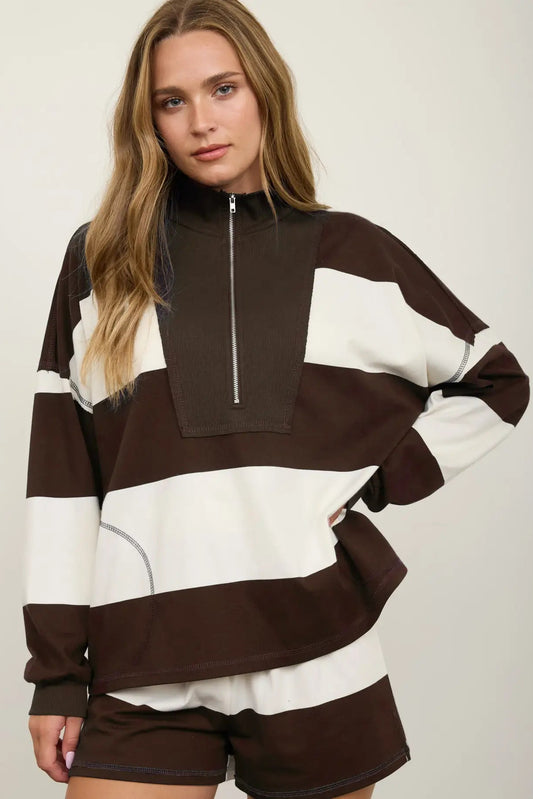 woman in wide stripe half zip pullover