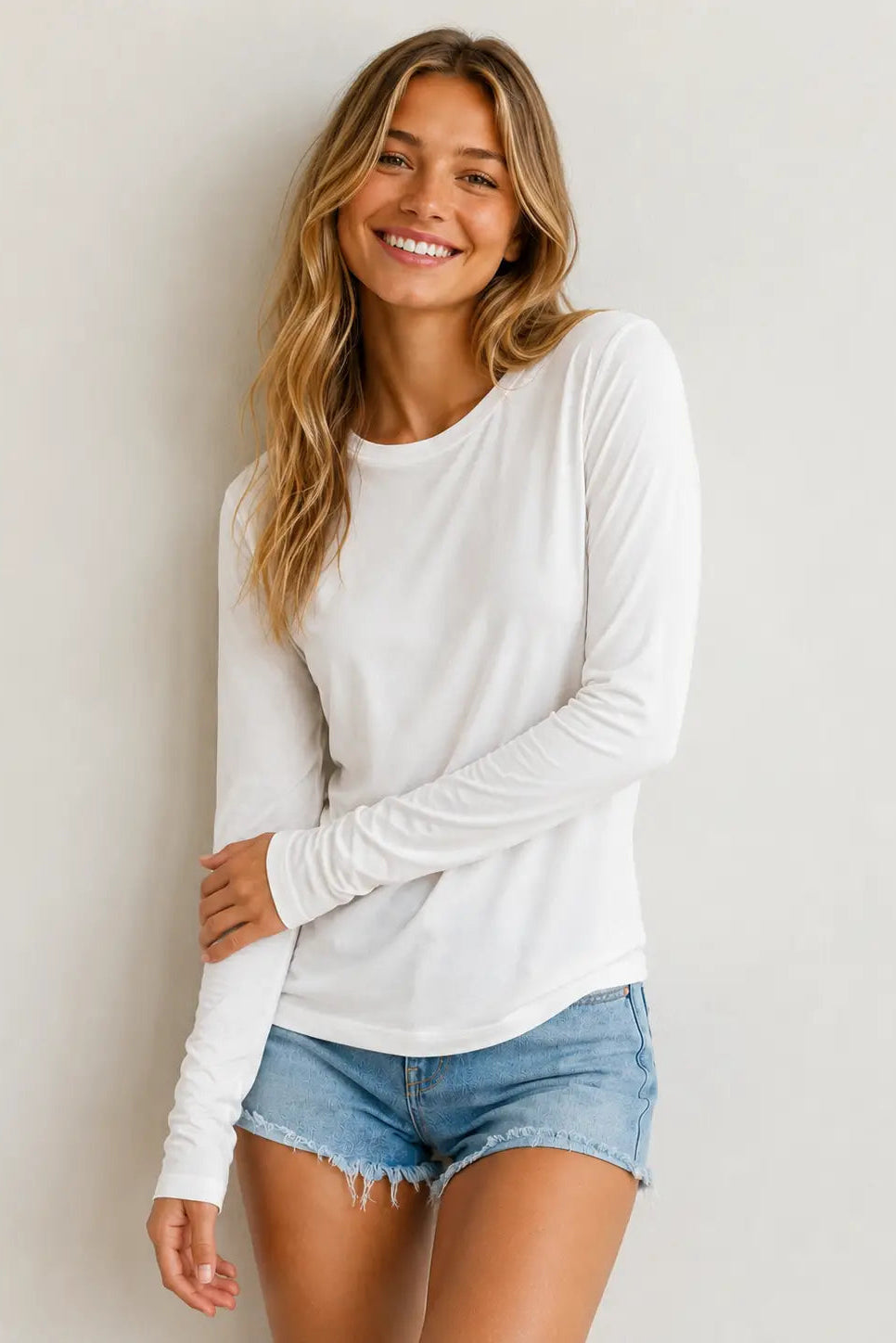 woman in long sleeve tee with shorts