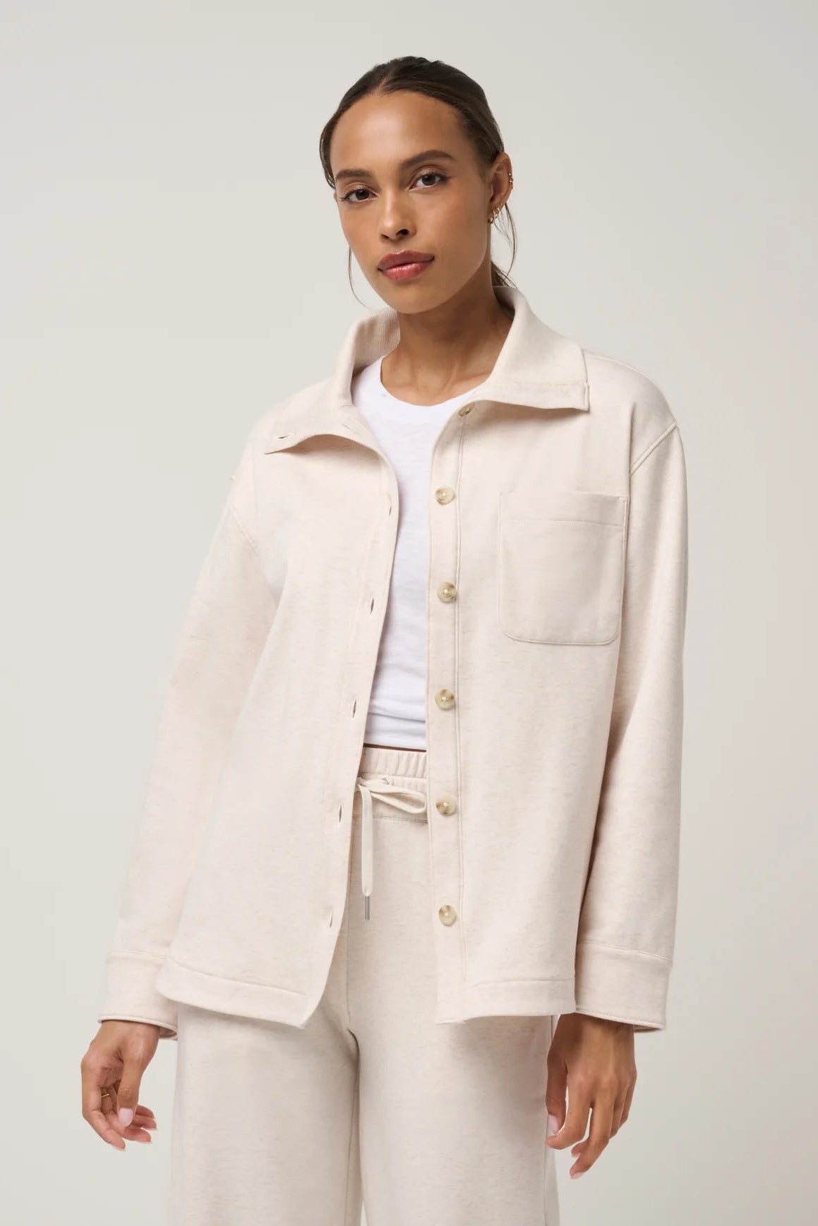 woman in button up shirt and pants