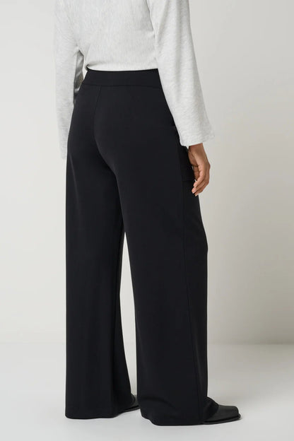back view of person in black pants